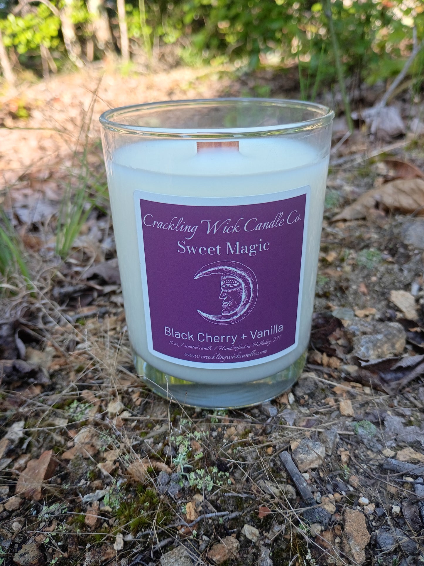 Glass jar candle with purple label for Black Cherry and Vanilla