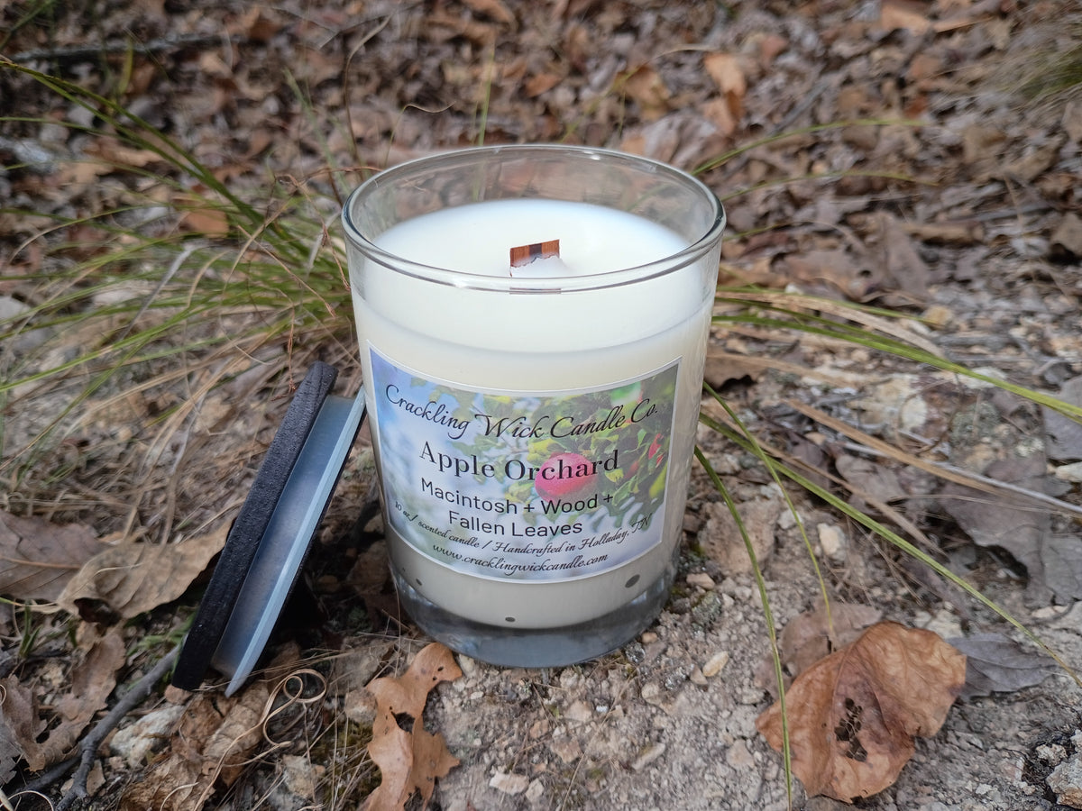Glass jar candle with white wax and printed label, no lid