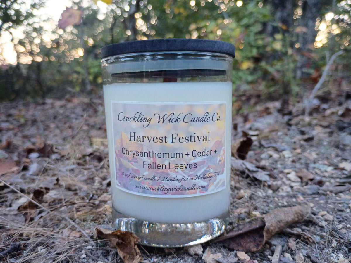 Harvest Festival jar candle with dark lid and silver base; label wrap visible