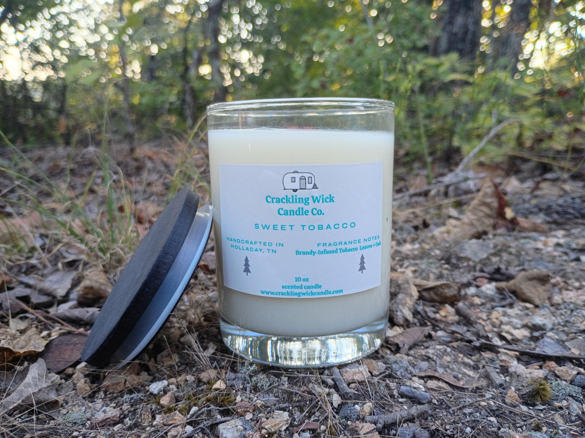 Glass jar candle with black lid and Sweet Tobacco label