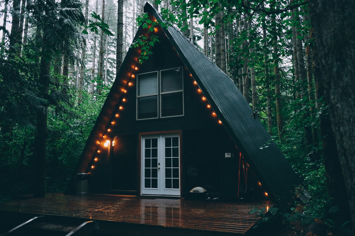 Wood cabin decor with string lights in a forest